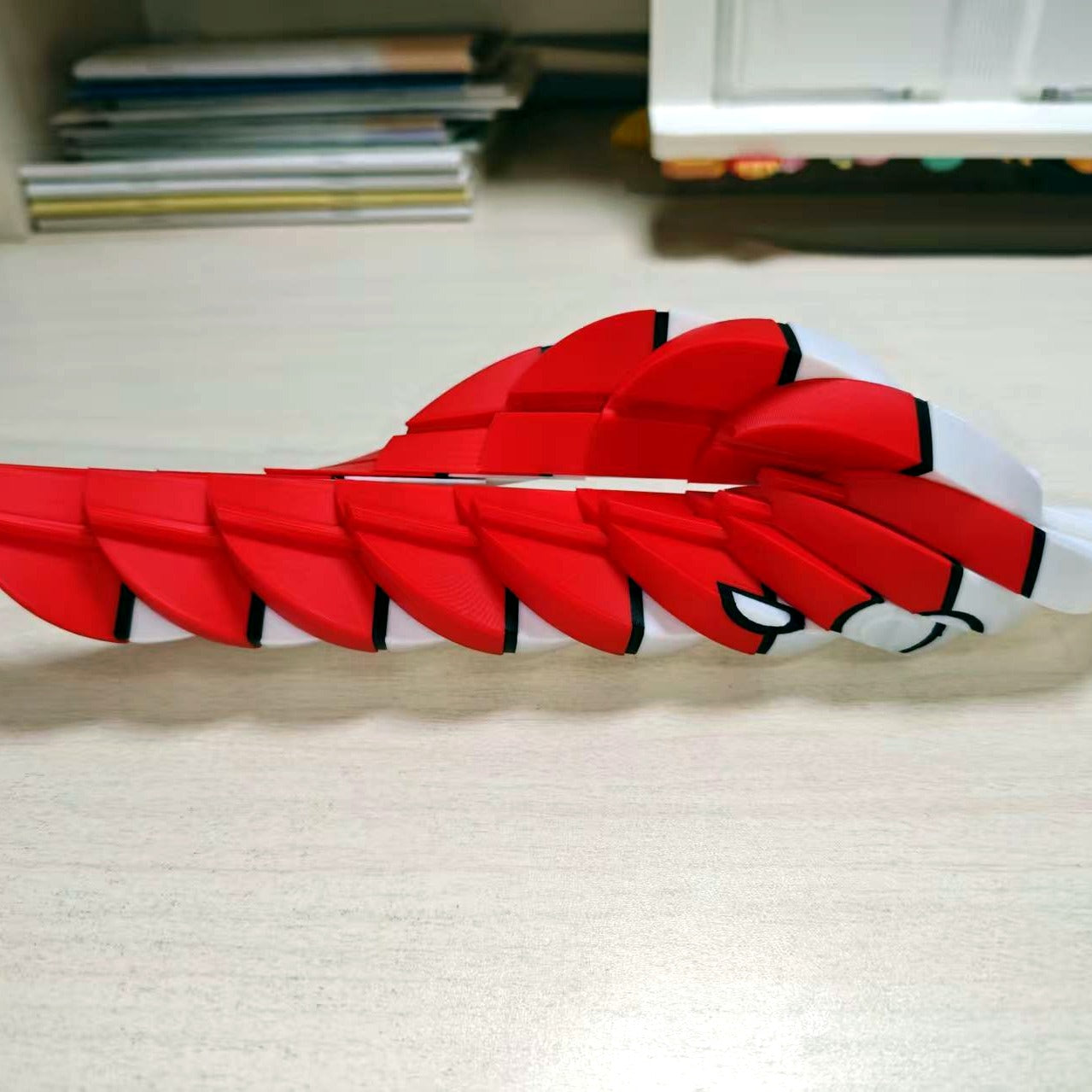 Poke Ball twisted open into a red and white spiral