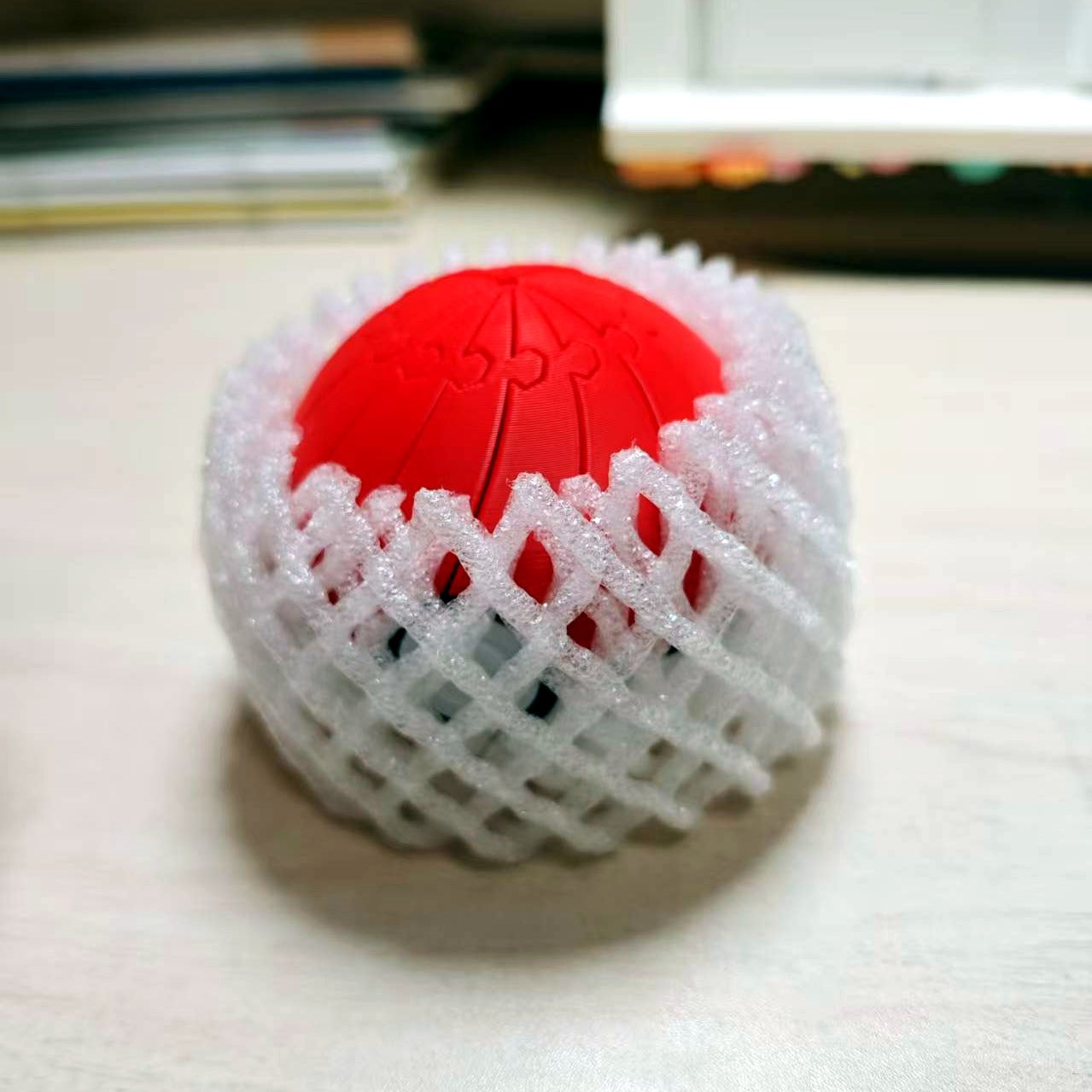 Poke Ball fidget in protective mesh packaging