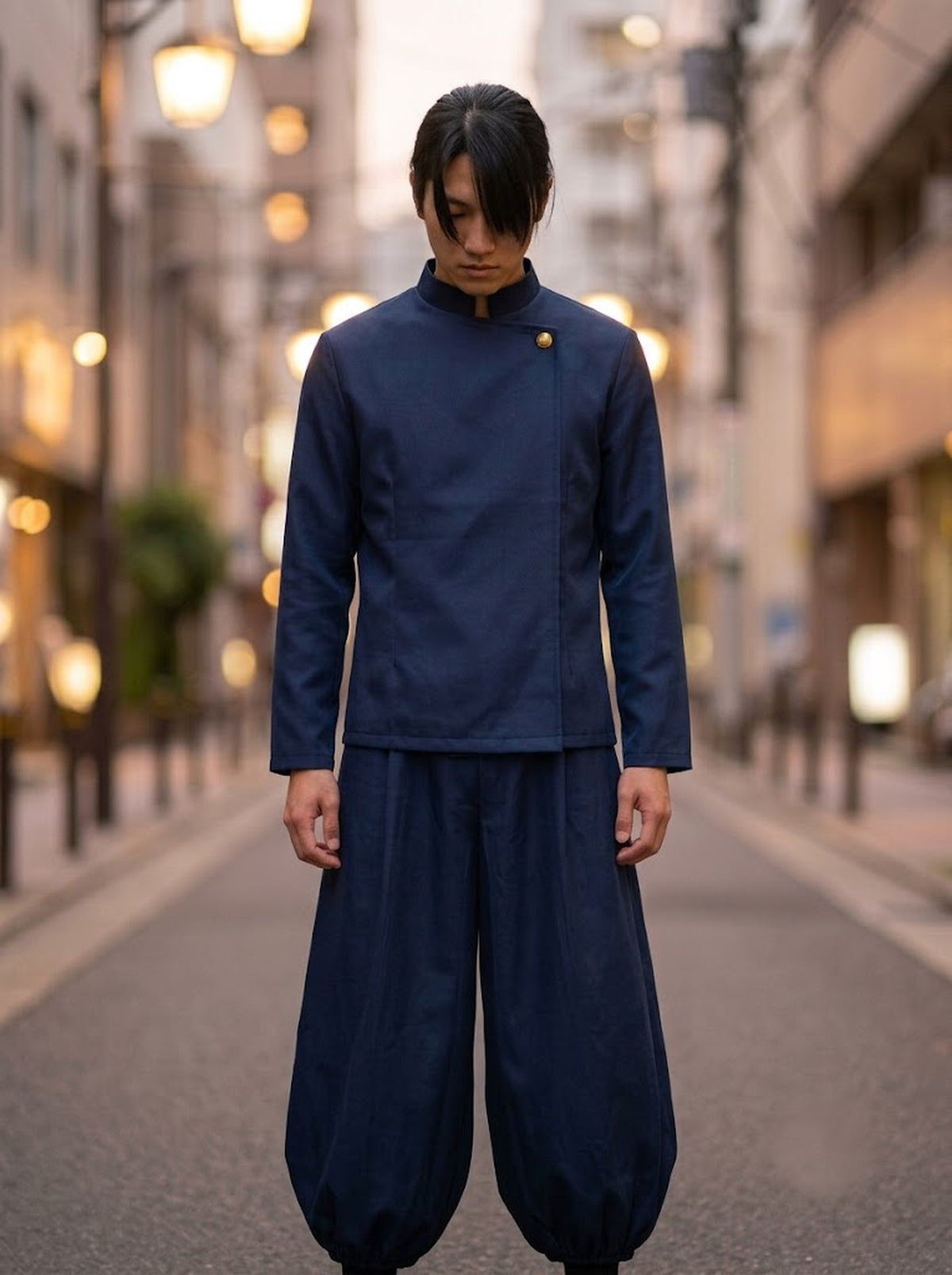 Navy asymmetric jacket and wide-leg pants set worn by model, front view