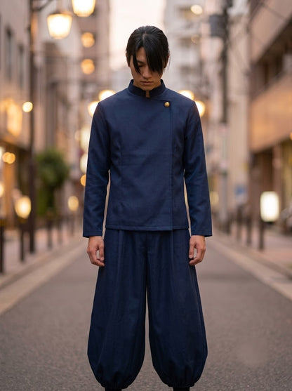 Navy asymmetric jacket and wide-leg pants set worn by model, front view