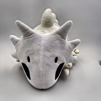 Bell Beast plush front view showing face and crown spikes