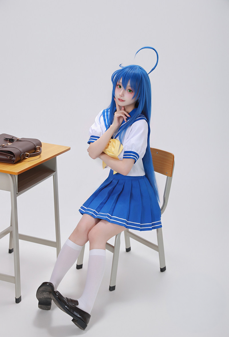 Blue and white sailor costume with yellow bow — seated full outfit