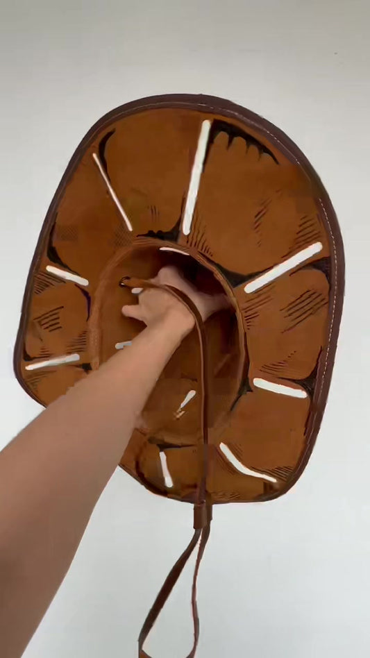 Actual chestnut brown cowhide executioner hat, underside and chin strap from the owner's video