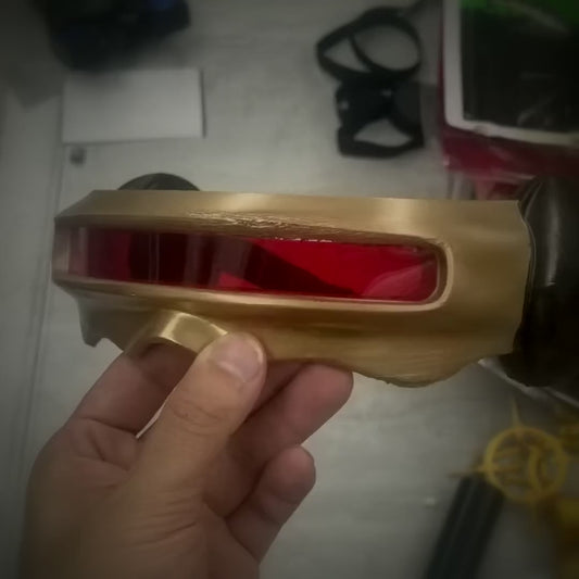 Hands-on video of the gold Cyclops visor prop, turning it to show the red lens, side pods and elastic strap