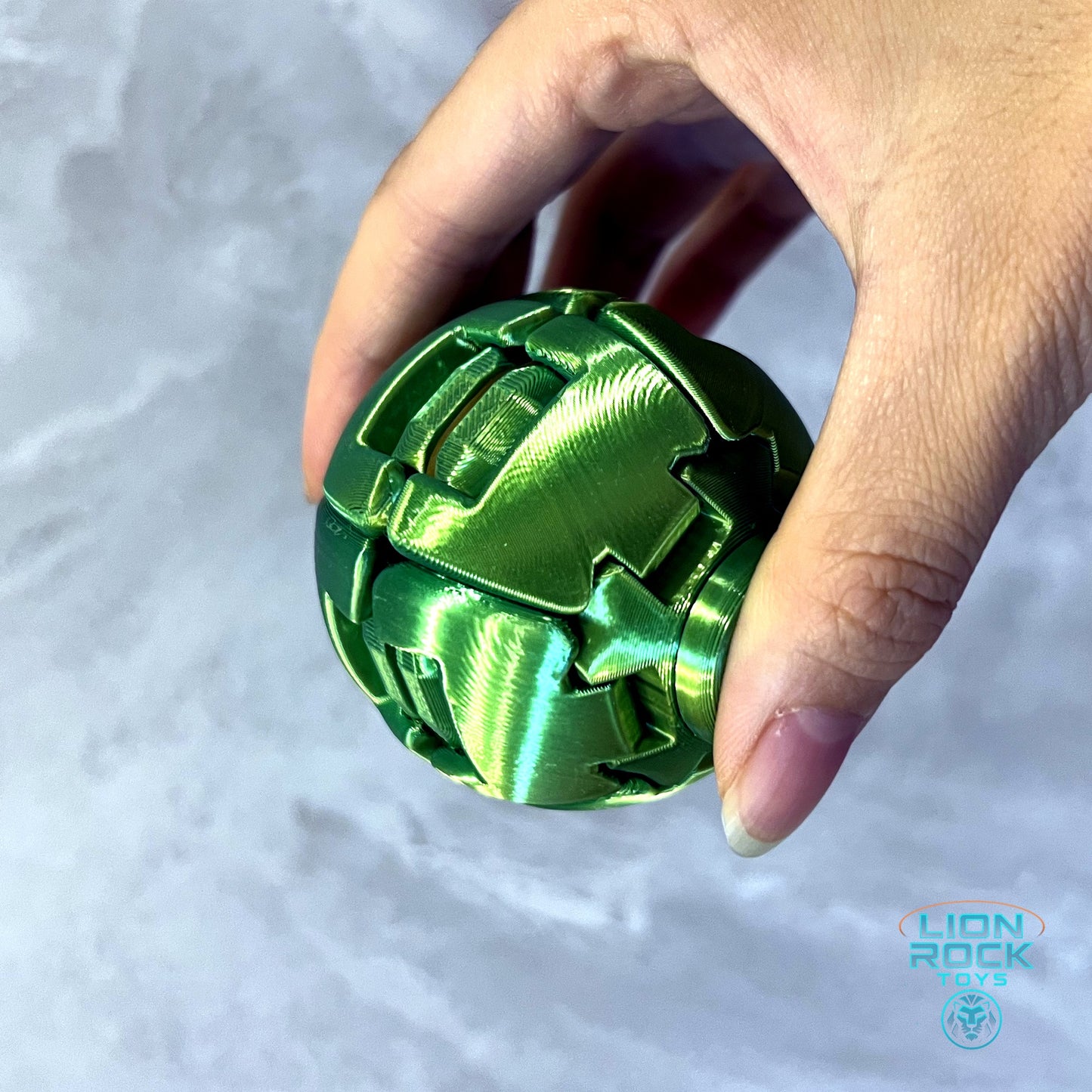 Steel Ball held in hand showing dual-tone green gradient