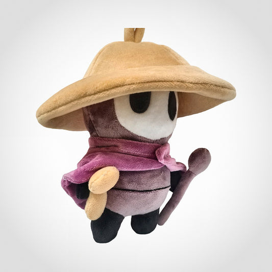 Sherma plush standing with straw hat on, holding chime staff