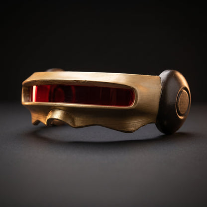 Side view of the gold visor showing the dark side pod and the full length of the red lens slot